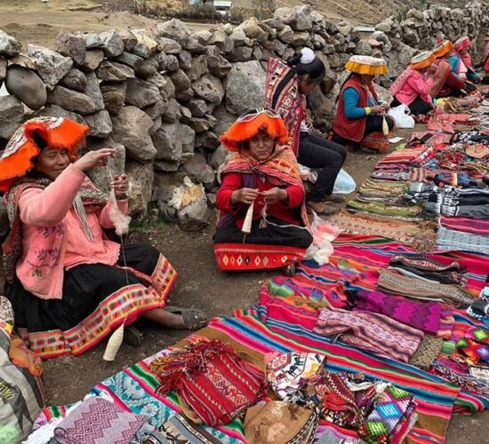 Lares trek 4 days will take you to see Andean women selling typical local clothes