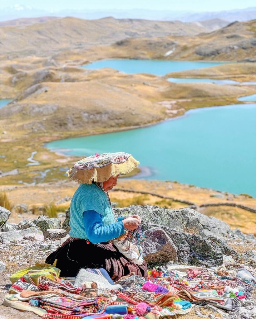 Beautiful view of the lagoon and an Andean woman.