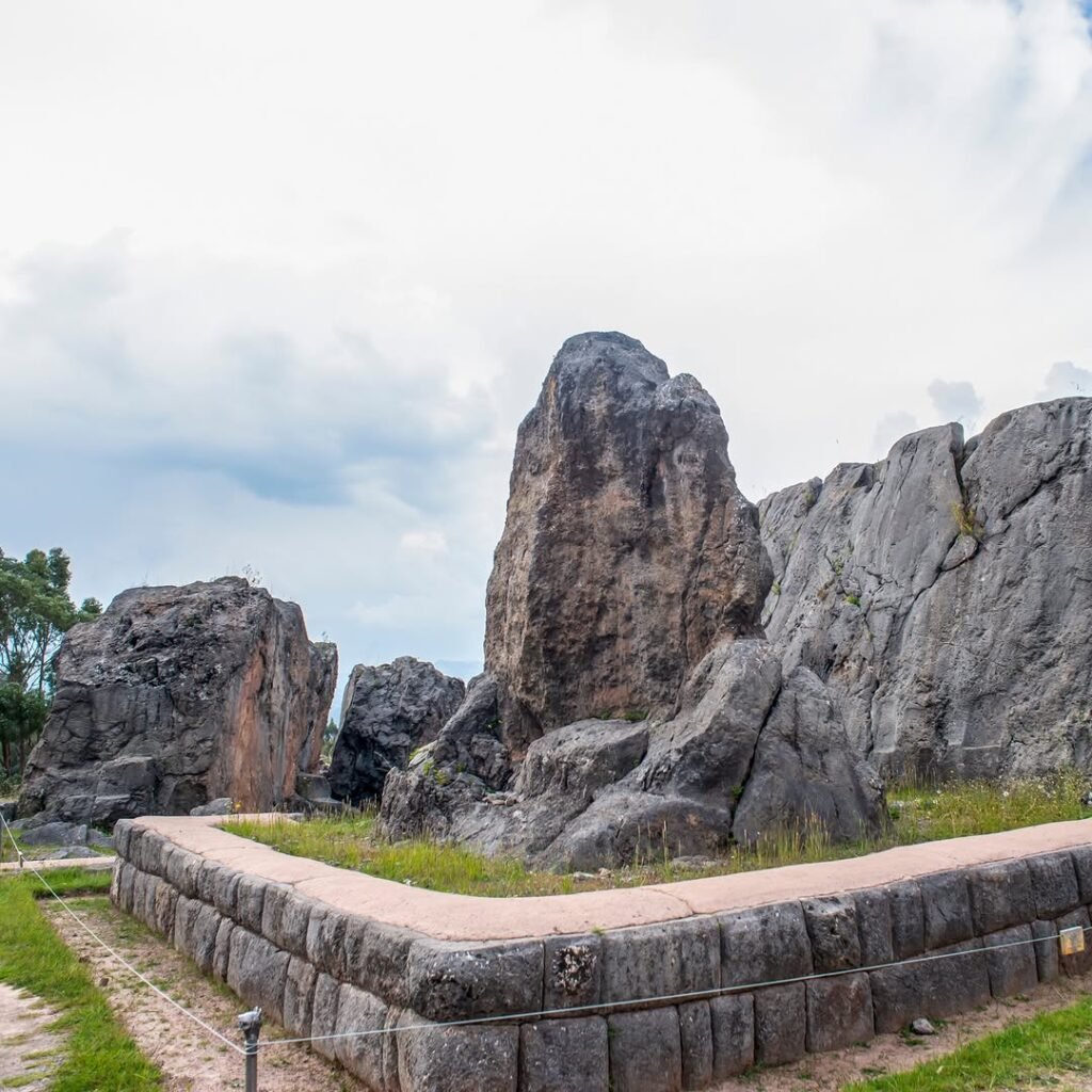 A low sun illuminates fragments of the Qenqo monolith