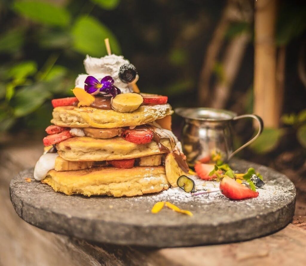 The fluffy vegan pancakes Accompanied by fruit and honey and craft beer